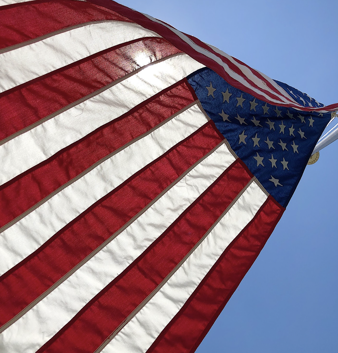 Firebrand Flag flying in the blue sky