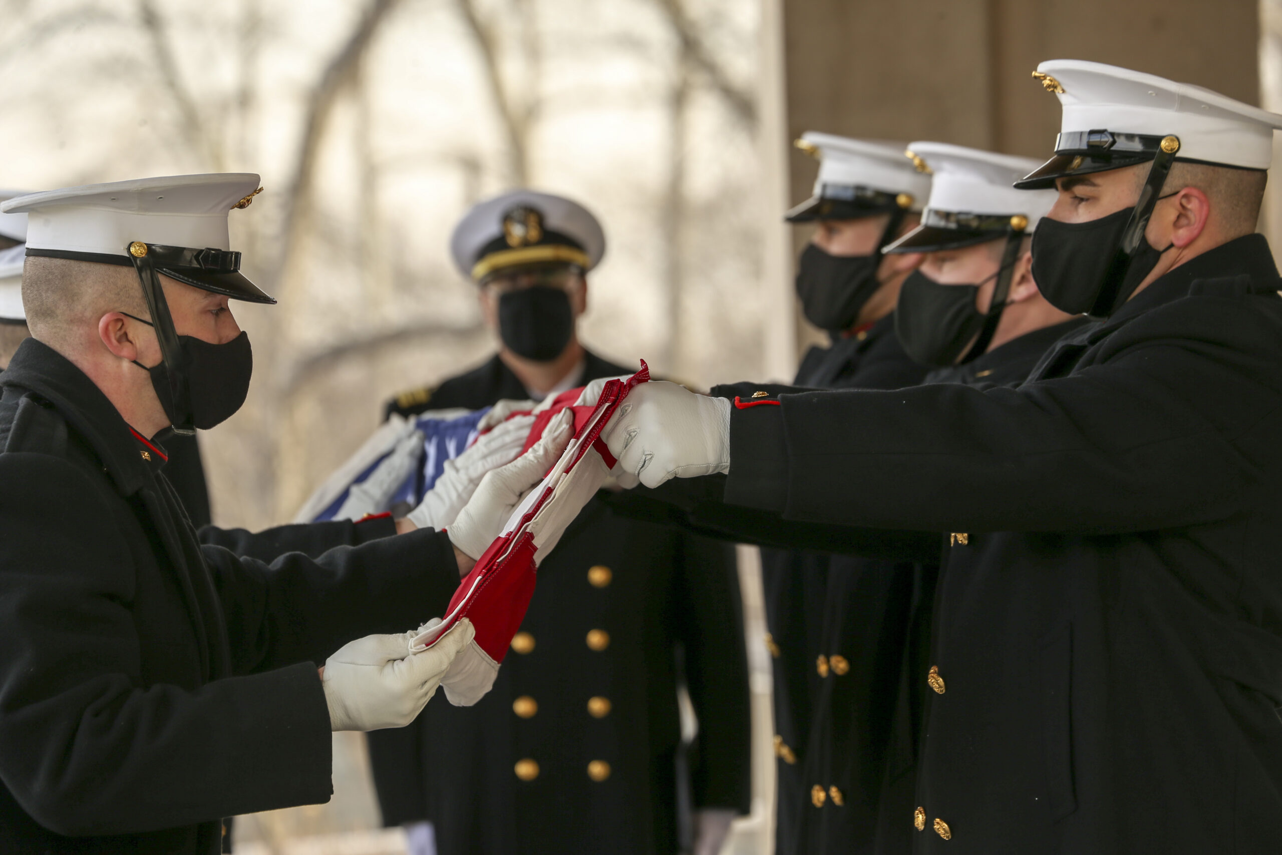 Photo of body bearers folding the flag of Brig. Gen. James R. Joy.