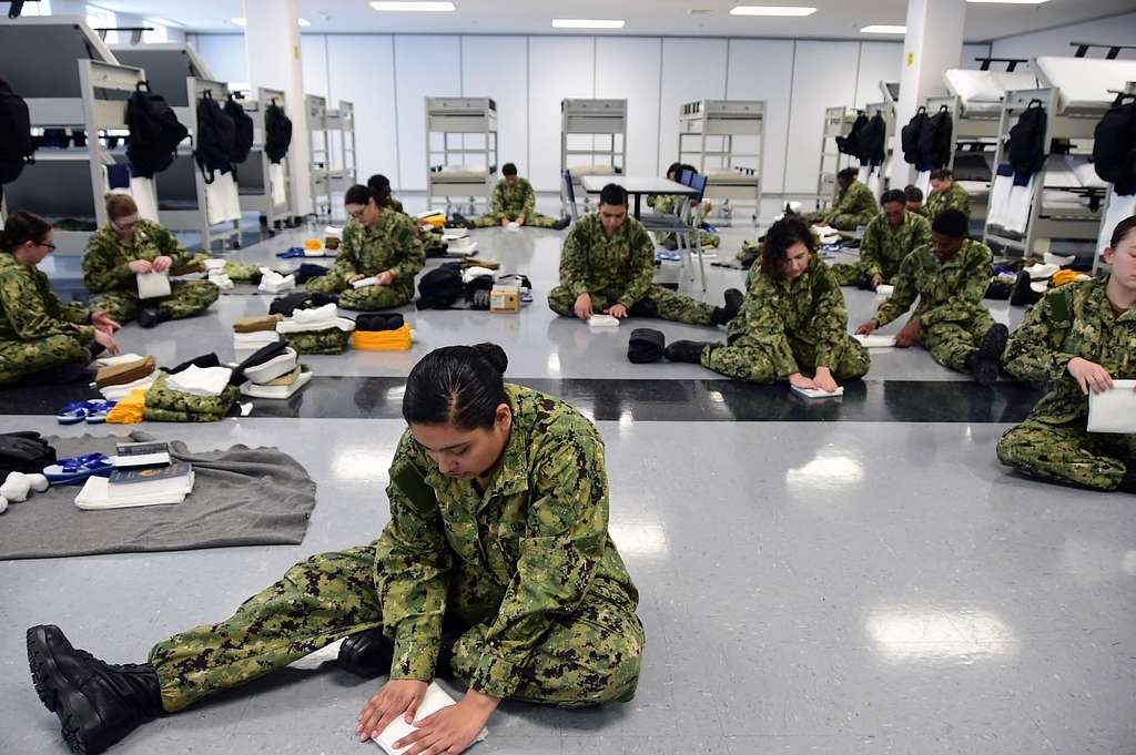 millennial soldiers fold flags