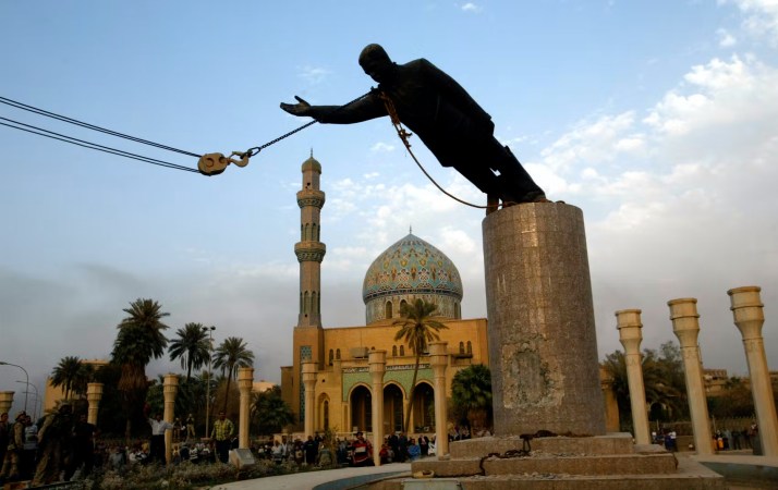 saddam dictators statue