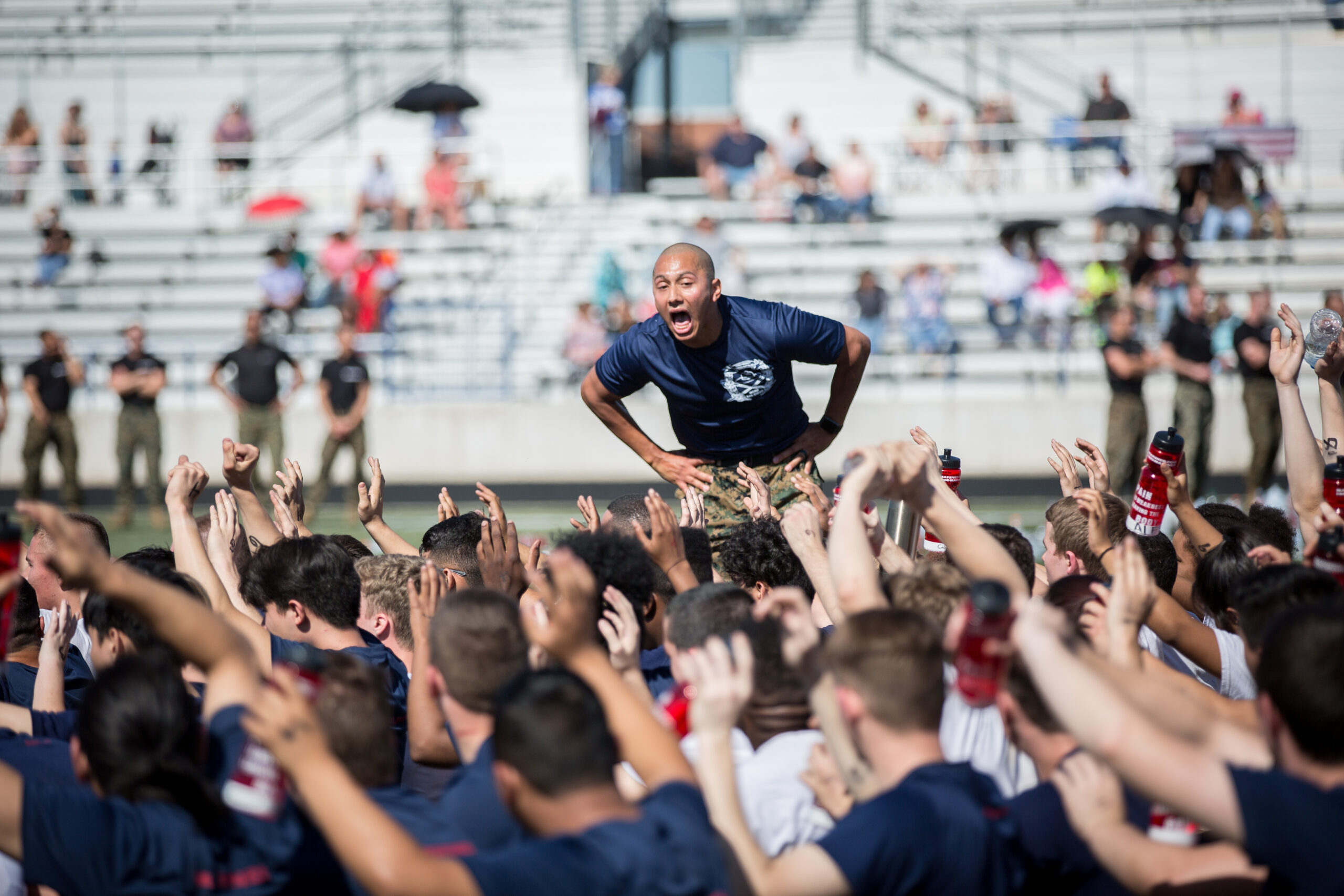 A drill instructor helping to prepare recruits for boot camp