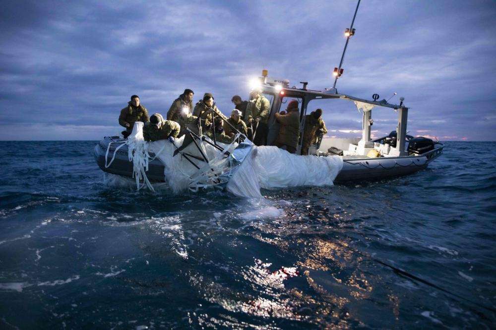 Sailors from EODGRU 2 recovery a high-altitude surveillance balloon off the coast of South Carolina