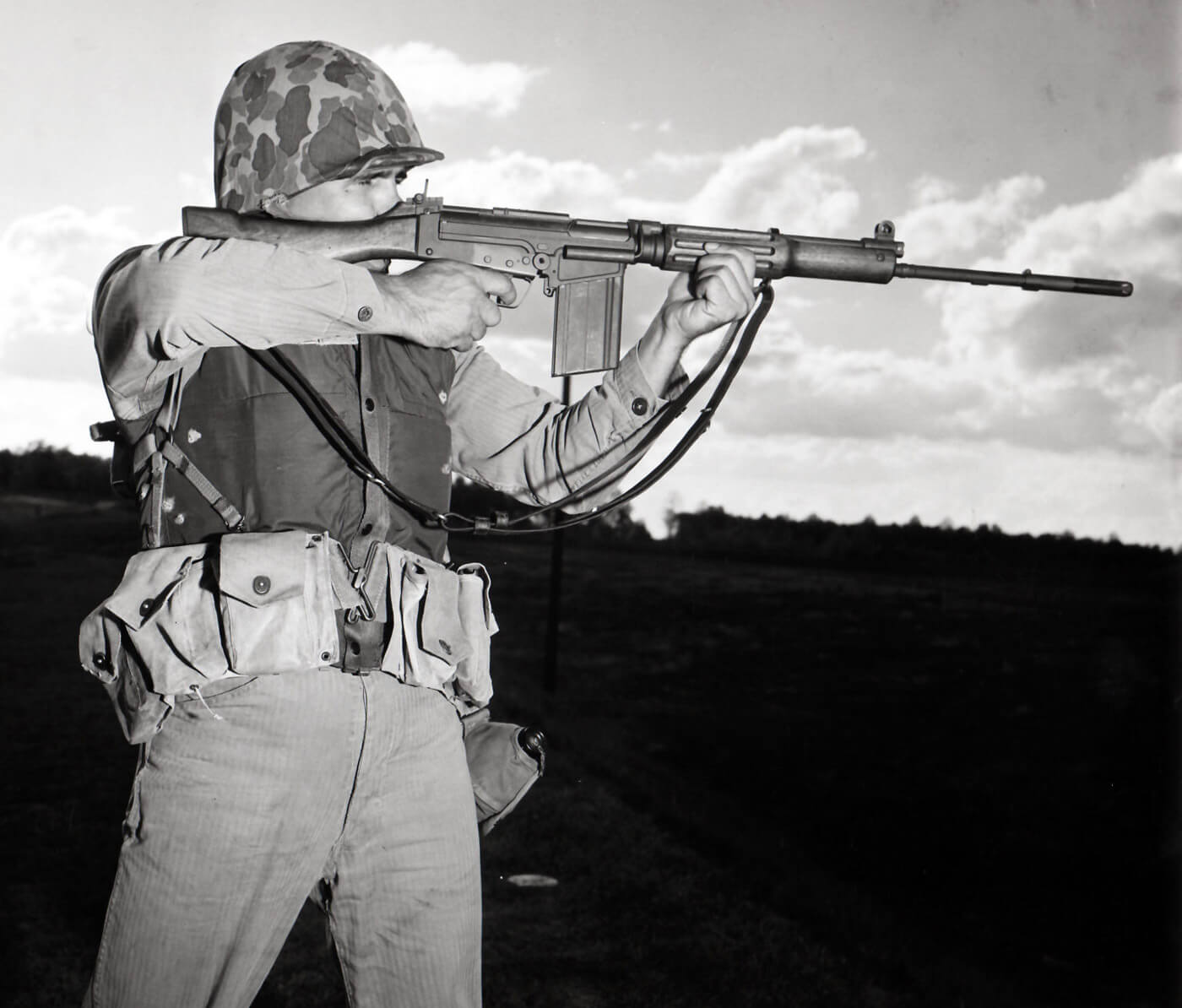 marine firing FAL over m14