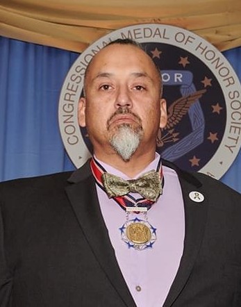 Richard Fierro wearing a medal.