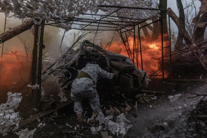 a ukranian soldier fires weapons