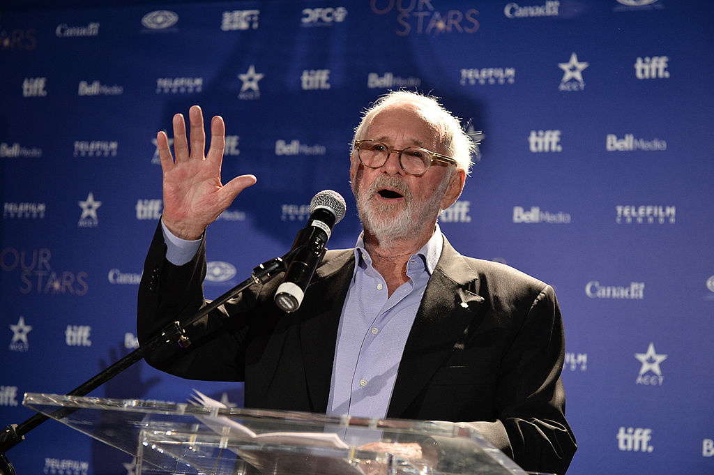 Norman Jewison speaks at a podium