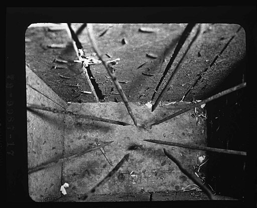 Description: View from the top into a box which is booby-trapped with punji sticks.

Punji sticks are sharpened and heated stakes, placed in the path of enemy troops, usually covered by undergrowth or placed in the bottoms of pits dug to trap enemies.