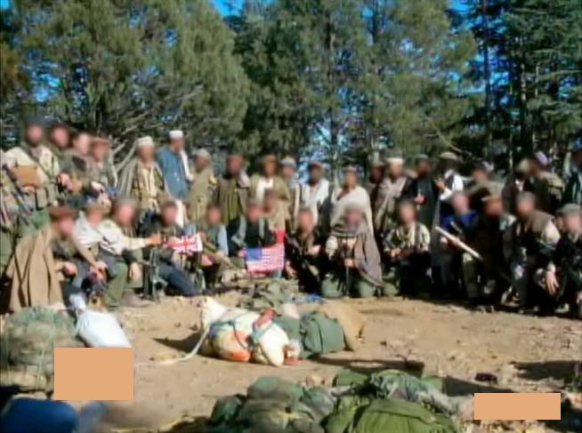 U.S. Combat Applications Group (Delta Force) and British Special Boat Service at Tora Bora pose for a photo on the beach