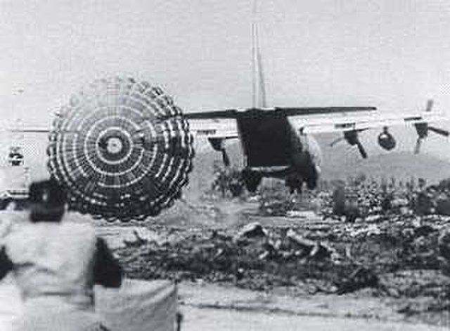 A US military plane drops supplies on the ground during the Battle of Khe Sanh in Vietnam during the Vietnam War