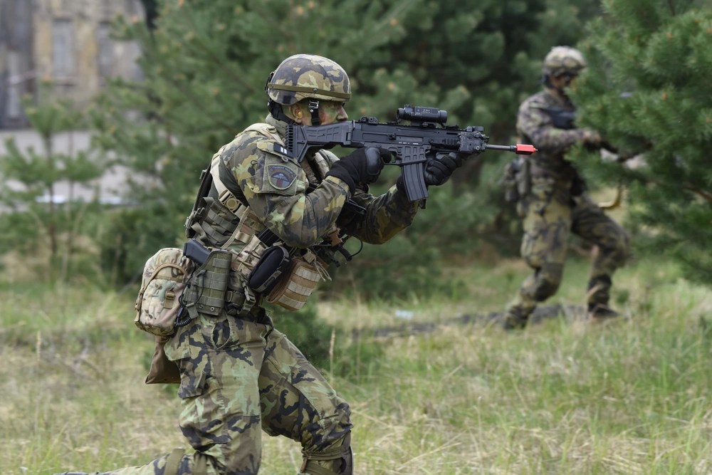 A soldier runs with a CZ BREN 2. Ukraine is seeking NATO membership