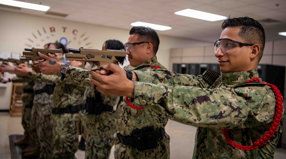 soldiers test pistols