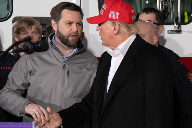 US Senator JD Vance (R-OH) (L) shakes hands with former US President Donald Trump during an event at the East Palestine Fire Department in East Palestine, Ohio, on February 22, 2023. - Hundreds of evacuated residents have been allowed to return home following a cargo train derailment in East Palestine, Ohio, on February 3, 2023, however many have voiced alarm over health issues, with some reporting headaches and stating that they fear they may end up with cancer in several years. (Photo by Rebecca DROKE / AFP) (Photo by REBECCA DROKE/AFP via Getty Images)