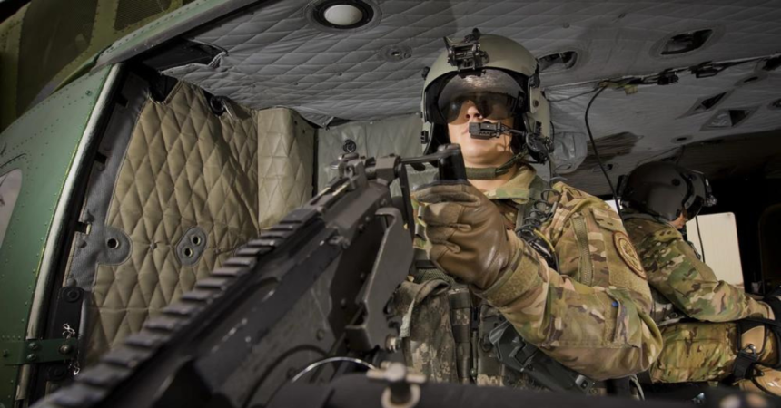 Senior Airman Shelby Duncan, 582nd Operational Support Squadron Det. 5 special missions aviator, mans an M240D machine gun at Minot Air Force Base, N.D., Sept. 14, 2016. The 54th Helicopter Squadron has two M240s per aircraft to help deter adversaries and defend the 91st Missile Wing’s Airmen and assets. (U.S. Air Force photo/Airman 1st Class J.T. Armstrong)