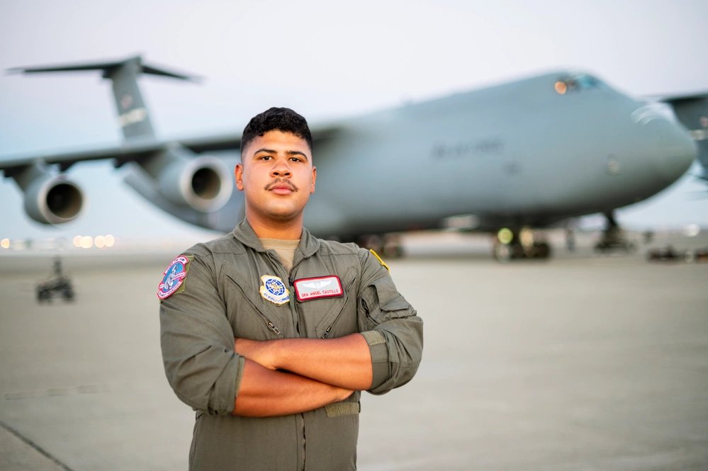 U.S. Air Force Senior Airman Angel Castillo, 22nd Airlift Squadron C-5M Super Galaxy loadmaster, poses for a photo during a Hispanic Heritage Month campaign at Travis AFB, California, August 16, 2022. National Hispanic Heritage Month is observed annually from September 15 to October 15. The month pays tribute to the generations of Hispanic Americans who have influenced and enriched our nation and society. (U.S. Air Force photo by Senior Airman Karla Parra)