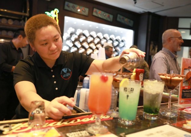 Yuko Portillo, bar chief at the Camp Zama Community Club Sports Bar, pours a Chocolate Espresso Martini, one of five nonalcoholic “mocktails” she created that were debuted during a social held there April 11. The drinks are now available at the Sports Bar, and there is no minimum age to purchase them.