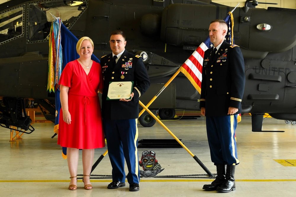 Chief Warrant Officer 4 James Morrow, a flight instructor from Fort Rucker, and wife celebrate his retirement along with Col. Bernard Harrington, the commander of the 82nd Combat Aviation Brigade June 30, 2017 at Fort Campbell, Ky. Both Harrington and Morrow formerly served with the 1st Battalion, 101st Aviation Battalion, 101st Combat Aviation Brigade and returned to Fort Campbell to celebrate Morrow's retirement. (U.S. Army photo by Sgt. Marcus Floyd, 101st Combat Aviation Brigade)