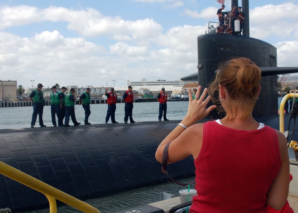 Family and friends gather to say goodbye as the attack submarine USS La Jolla departs for a scheduled six-month deployment to the western Pacific.