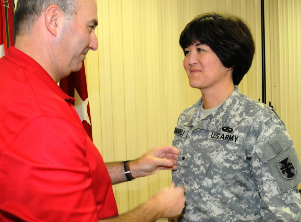 Army Reserve Brig. Gen. Miyako Schanely, deputy commander, 412th Theater Engineer Command, is pinned her one star by her husband, Steve, in a ceremony held at the TEC's headquarters in Vicksburg, Miss. Schanely, a resident of Black River, N.Y., is the first female Japanese-American and the first female Engineer in the Army Reserve and second in the Army to be promoted to General Officer.