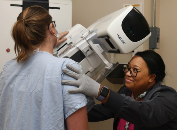 JACKSONVILLE, FL. (September, 15, 2023) Amanda Lapointe, a mammography technologist at Naval Hospital Jacksonville, assists a patient during a mammogram. Lapointe, a native of Jacksonville, Florida, says, “Early detection saves lives.” TRICARE covers an annual screening mammogram for women age 40 and over. October is Breast Cancer Awareness Month. (U.S. Navy photo by Deidre Smith, Naval Hospital Jacksonville/Released). #FacesofNHJax #BreastCancerAwareness