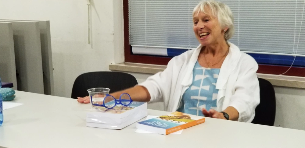 Writer Myra Robinson enjoys her visit with the Vicenza Library book club Sept. 6 on Caserma Ederle. Robinson spent the evening with about 20 members of the community to discuss her book, "The Best Mud in Italy."