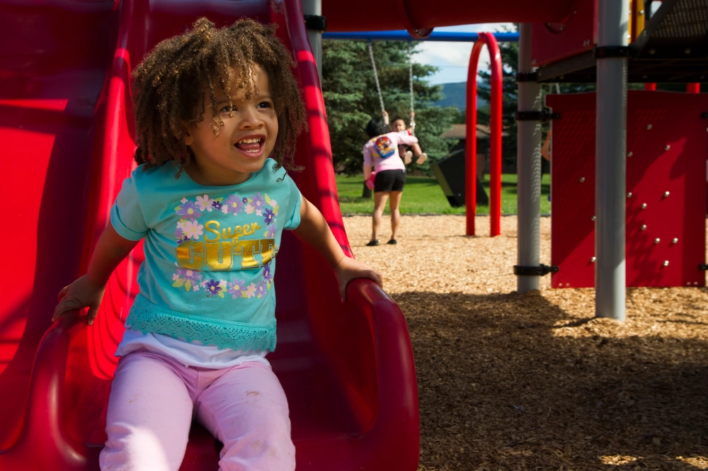 Girl playing on slide
