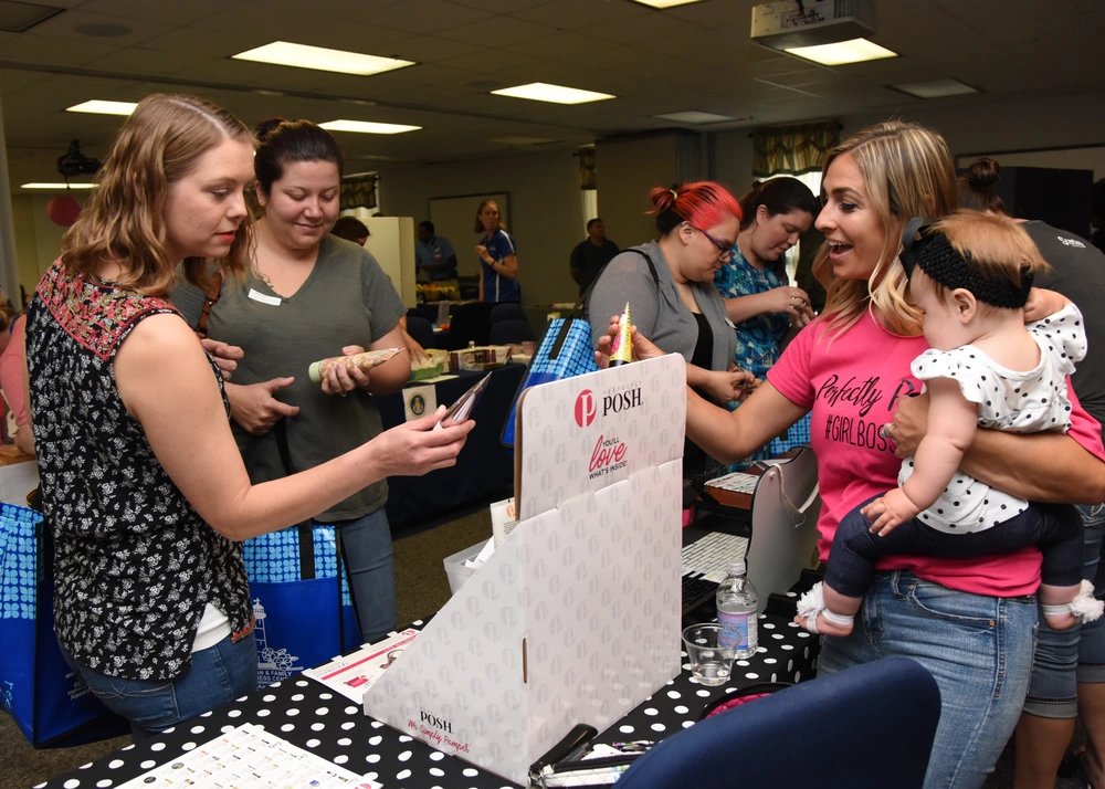 Military spouses attend Pamper Me Day in the Sablich Center at Keesler Air Force Base, Mississippi, May 3, 2018. The 81st Force Support Squadron Airman & Family Readiness Center has hosted the event for the past 14 years, offering military spouses information and business booths, free manicures, makeup tips and giveaways. (U.S. Air Force photo by Kemberly Groue)