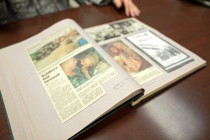 A scrapbook of Desert Storm articles and photos lays open on a table at Mountain Home Air Force Base, Idaho, Jan. 13, 2016. Maj. Alexander Palomaria, 366th Fighter Wing deputy chaplain, used scrapbooking as a way of coping with the war.(U.S. Air Force photo by Airman 1st Class Jessica H. Evans/RELEASED)