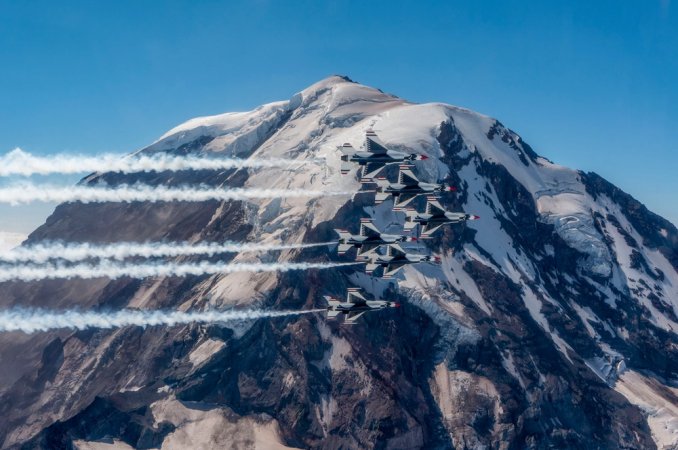 The United States Air Force Air Demonstration Squadron "Thunderbirds" fly over Mount Rainier, Washington, July 17, 2023. The Thunderbirds performed the flyover during their return to Nellis Air Force Base, Nevada, from the JBLM Air Show and Warrior Expo at Joint Base Lewis-McChord, Washington. (U.S. Air Force photo by Staff Sgt. Dakota Carter)