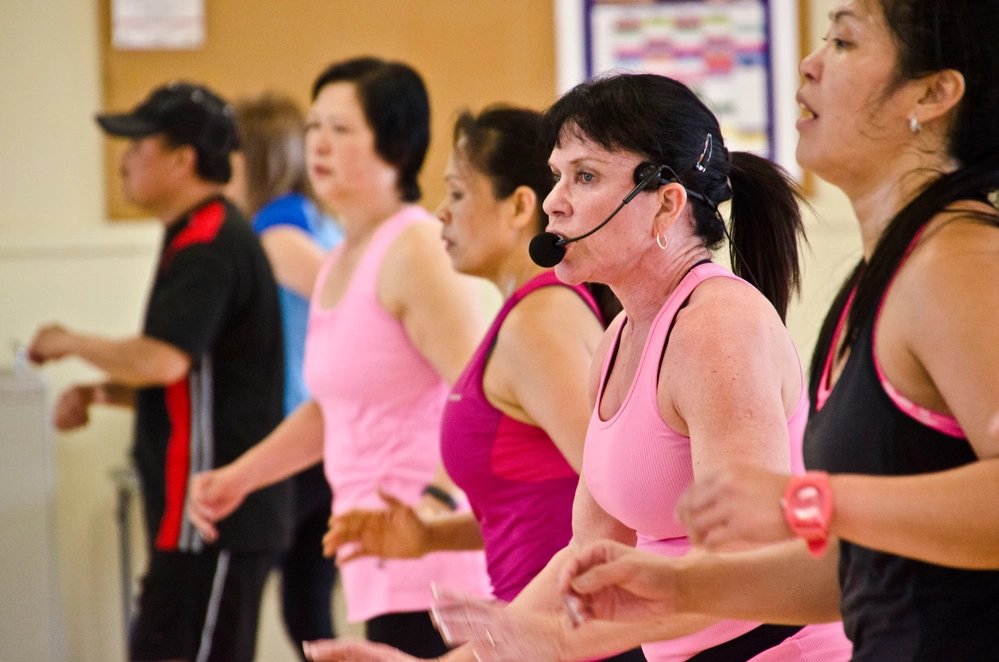 Sharon Morejon, a fitness specialist, leads a cardio kickboxing class at Jensen Family Health and Fitness Center on Joint Base Lewis-McChord, Wash., March 19, 2015. This year marks Morejon’s 30-year anniversary as a fitness specialist. (U.S. Army photos by Sgt. Jasmine Higgins, 28th Public Affairs Detachment)