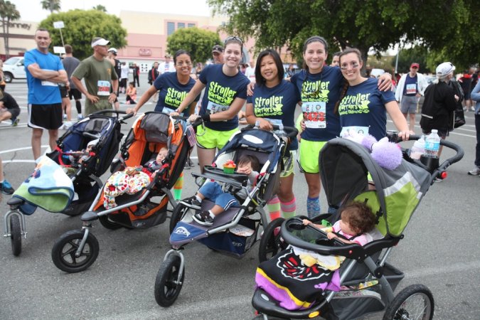 Members of the Stroller Warriors wait at the starting point of the Laguna Hills Memorial Day Half Marathon in Laguna Hills, Calif., May 28. The women of the club are all wives of active duty Marines and meet weekly to train for different race events in the area.