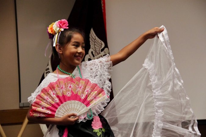 Marissa Vasquez, 7, a dancer with the Mexican Foklorico Dance group, performance a Baile folklrio, a folklore dance, with Fort Bliss Child, Youth, Services (CYS) and SKIESUnlimited, who works with students to present a variety of traditional dances along with gaining knowledge in Mexican culture during the WBAMC Hispanic Heritage Observance Month, September 12, 2019, in the clinical assembly room of the main hospital. Folklorico has become a defining element of the Mexican popular culture of national and internal levels.