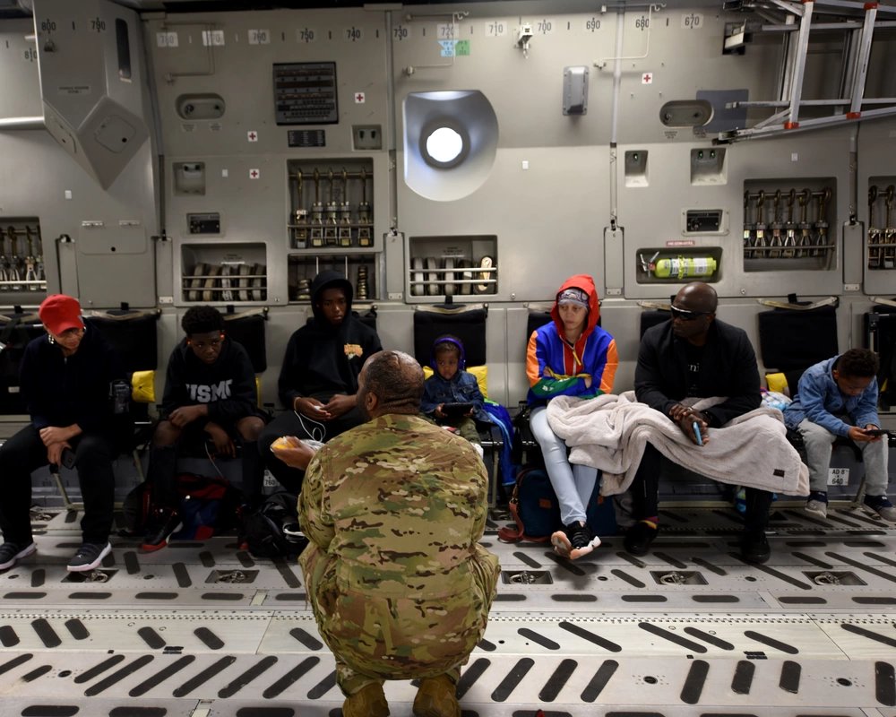 U.S. Air Force Staff Sgt. James Armstrong, 21st Airlift Squadron loadmaster, provides a flight safety briefing to space-available passengers on a C-17 Globemaster III May 17, 2019, at Travis Air Force Base, California. Space-Available, or Space-A, air transportation is available, for those eligible, when missions and cargo loads allow.