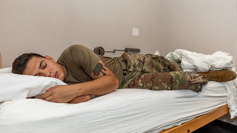 A Soldier demonstrates how on of the sleep study suites are used at the Center for Military Psychiatry and Neuroscience of the Walter Reed Army Institute of Research, Oct. 26, 2021. WRAIR conducts sleep restriction and deprivation studies and evaluates countermeasures to develop knowledge products and materiel solutions to enhance Soldier alertness, decision-making, and performance .