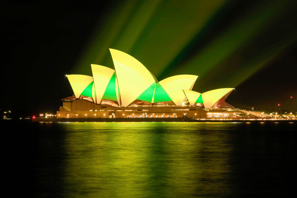 SYDNEY, AUSTRALIA - 2024/08/01: Sydney Opera House is lit up in green and gold, Australia's national colours, in support of the Australian team for the Paris 2024 Olympic Games. The Australian landmark, Sydney Opera House was lit up in green and gold colours today in support of the Australian team for the Paris 2024 Olympic Games. (Photo by George Chan/SOPA Images/LightRocket via Getty Images)