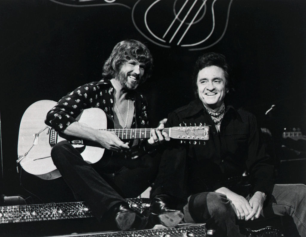 (Original Caption) 9/15/1976-Kris Kristofferson (L) and Johnny Cash perform a duet on "The Johnny Cash Show."