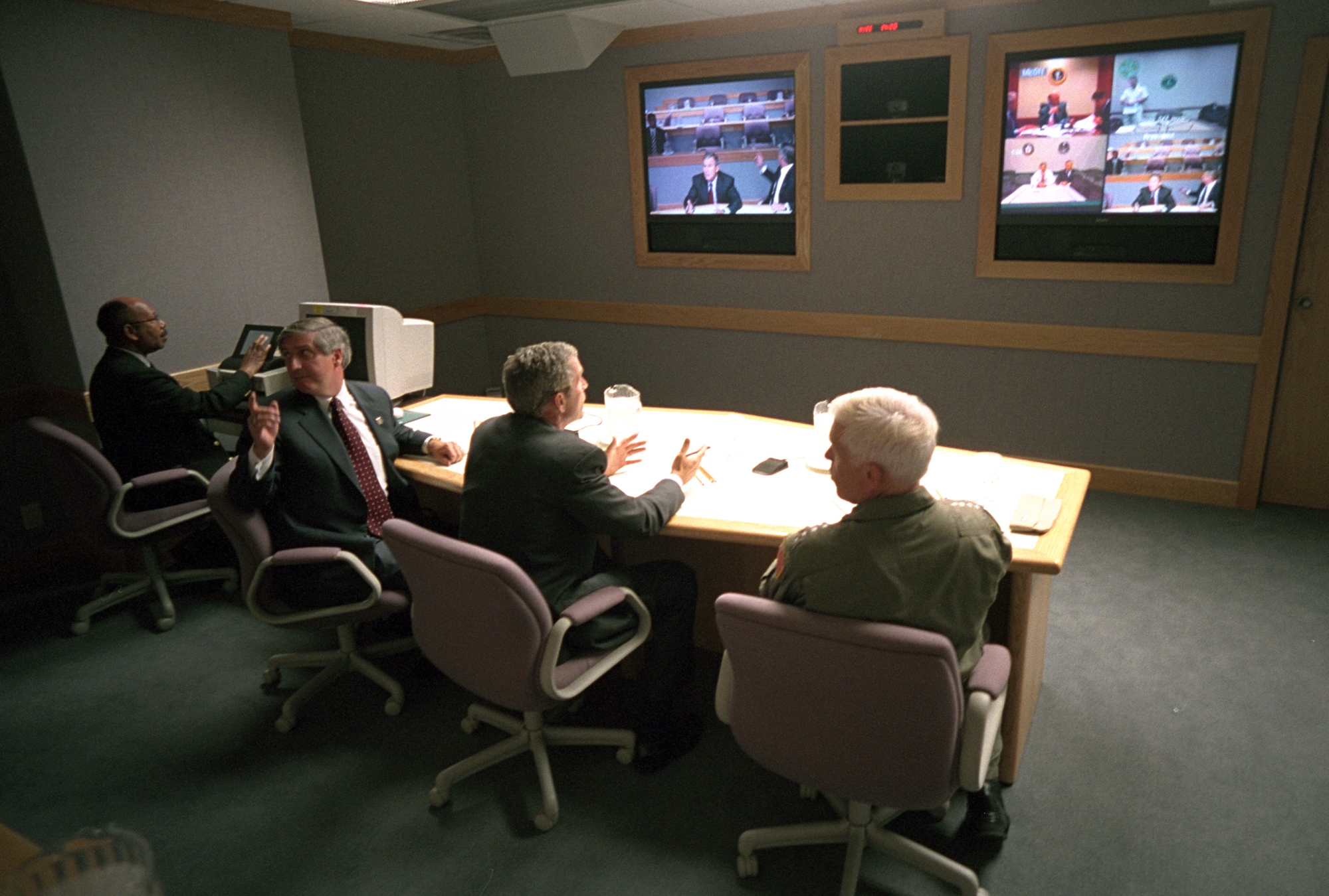 President George W. Bush, White House Chief of Staff Andy Card, left, and Adm. Richard Mies conduct a video teleconference Tuesday Sept. 11, 2001, at Offutt Air Force Base in Nebraska. Photo by Eric Draper, Courtesy of the George W. Bush Presidential Library