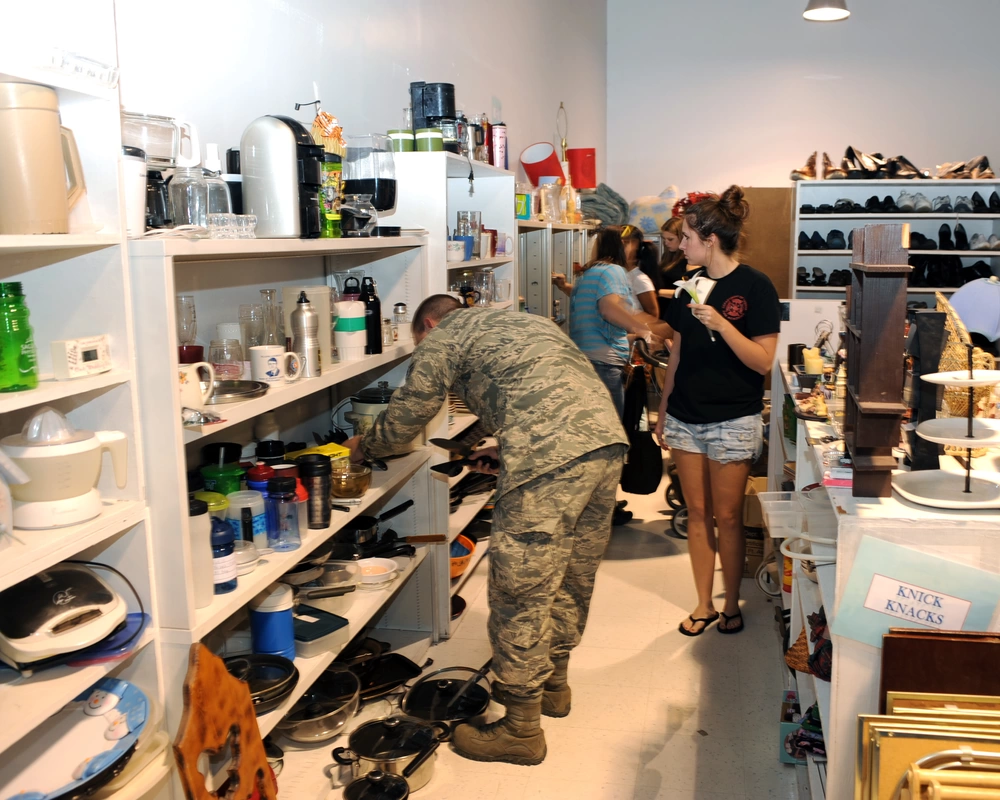 Patrons browse items throughout the Airmans Attic at Davis-Monthan Air Force Base, Ariz., Jan. 30, 2014. The Attic serves as a donation center for airmen that may need, but are unable to afford things such as furniture, kitchen and other household items and uniforms. (U.S. Air Force photo by Airman 1st Class Chris Massey)