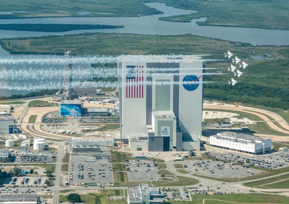 The United States Air Force Air Demonstration Squadron "Thunderbirds" fly over the John F. Kennedy Space Center, Florida, April 13, 2023. The Thunderbirds were in town for the Cocoa Beach Air Show, located on Florida’s “Space Coast,” an area known as NASA’s homebase for manned missions to the moon and the Space Shuttle. (U.S. Air Force photo by Staff Sgt. Dakota Carter)