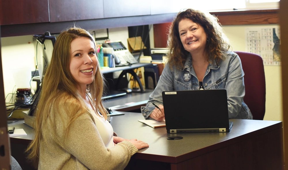 Capt. Ashley Thropp seeks financial services advice from Jennifer Wood, one of the Idaho National Guard's financial counselors who provide tax assistance, offer support and counseling opportunities for credit management and provide training in money management, budgeting and home buying. They also help service members of all branches in reaching long term goals, such as emergency savings, education, buying a house and retirement.