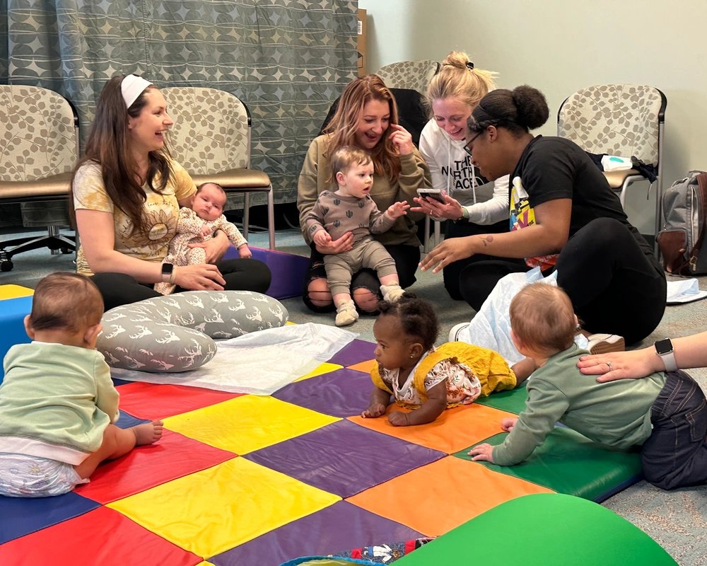 Participants at Blanchfield Army Community Hospital’s Mom & Me breastfeeding support group share a laugh while getting their babies together for play during a meeting March 20. In addition to support from a certified lactation consultant, Mom & Me is also an opportunity for moms to meet other lactating or breastfeeding moms, which enables them to develop peer-to-peer relationships for mutual support.