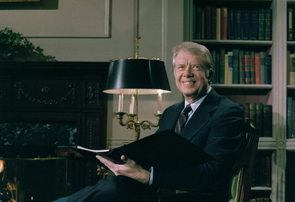 Jimmy Carter delivers his Fireside Chat from the library in the White House. ca. 1 February 1978. (Photo by: Hum Images/Universal Images Group via Getty Images)