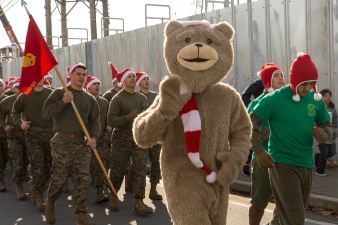 Service members with Marine Wing Support Squadron 171 participate in the Jingle Bell Jog, Dec. 19, 2014, aboard Marine Corps Air Station Iwakuni, Japan. Marine Corps Community Services hosted the event to help raise morale during the holiday season. The 1.5km event had more than 1,400 participants from various units aboard station.