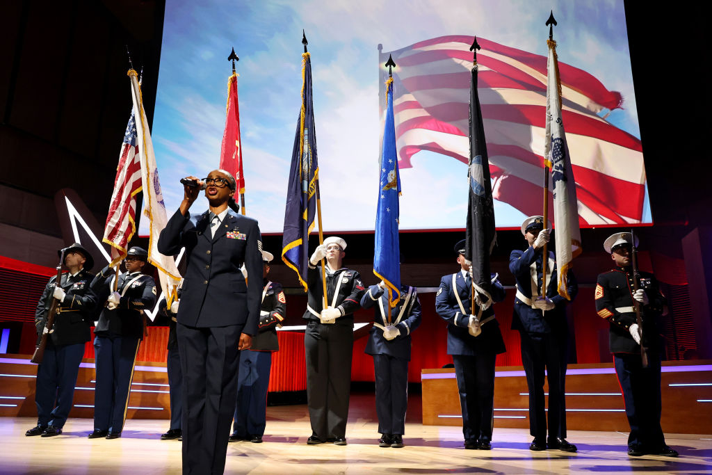 NEW YORK, NEW YORK - NOVEMBER 11: The Color Guard sings the national anthem during the 18th Annual Stand Up For Heroes Benefit Presented By Bob Woodruff Foundation And New York Comedy Festival at David Geffen Hall on November 11, 2024 in New York City. (Photo by Jamie McCarthy/Getty Images for Bob Woodruff Foundation)