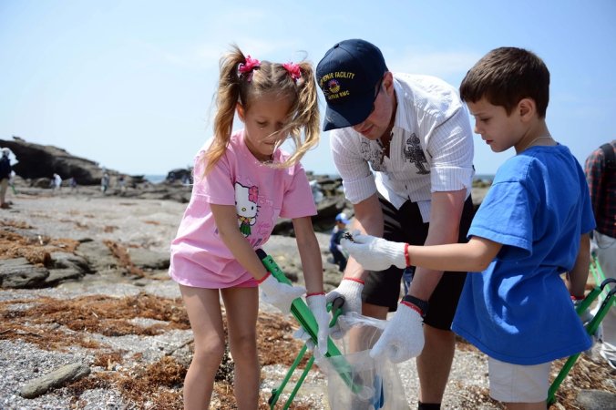 Yeoman 1st Class Joseph Kunkel, assigned to Ship Repair Facility Yokosuka, participates in a beach clean up with his family and members of the Fleet Activities Yokosuka chapter of Coalition of Sailors Against Destructive Decisions (CSADD) at Jogashima Beach. CSADD's mission is to encourage positive social interaction, development of leadership and decision-making skills among junior sailors. (U.S. Navy photo by Mass Communication Specialist 3rd Class Declan Barnes/Released)