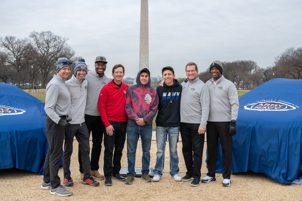 USAA executives, military service members and NFL legends Robert Griffin III and Joe Theismann are seen at USAA’s Army-Navy Game NABC Recycled Rides Car Gifting event in Washington on Friday, December 13th, 2024. The event was held to showcase USAA’s commitment to serving the military community and the spirit of ‘America’s Game’ gifting vehicles to Army and Navy families in need. (Photo by Joy Asico-Smith/AP Images for USAA)