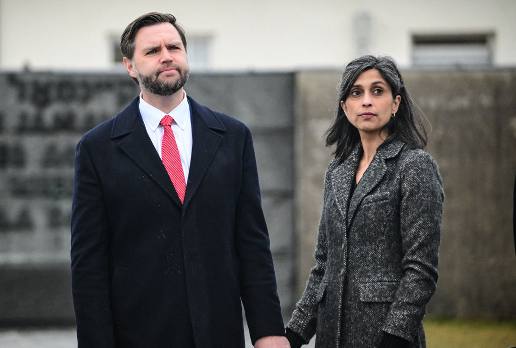 US Vice President JD Vance (L) stands with his wife Usha Vance as they take part in a tour of the Dachau Concentration Camp memorial site in Dachau, southern Germany, on February 13, 2025. The US Vice President will participate in the Munich Security Conference (MSC). (Photo by Tobias SCHWARZ / AFP) (Photo by TOBIAS SCHWARZ/AFP via Getty Images)