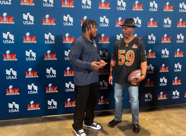 Josh Jacobs presents Kevin Bennett with Super Bowl tickets. Photo courtesy USAA.