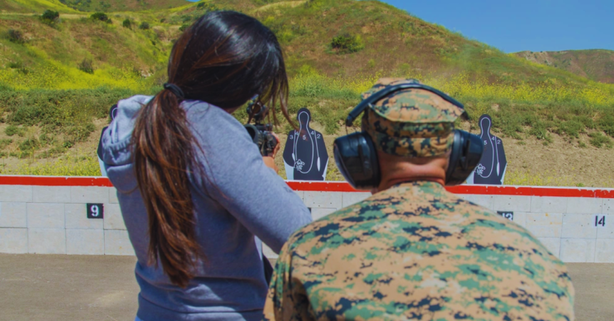 U.S. Marines with Headquarters and Support Battalion, Marines Installations West, help coach spouses of prior and serving military members on shooting an m16 rifle during "J" Wayne Day at the Wilcox Pistol Range on Camp Pendleton, Calif., April 28, 2017. “J” Wayne Day is an event when spouses the spouses or loved ones have a chance to participate in multiple activities such as the Marine Corps Martial Arts, Pistol Range and the Fire Crash and Rescue followed by various demonstrations and displays. (U.S. Marine Corps photo by Lance Cpl. Brooke Woods)