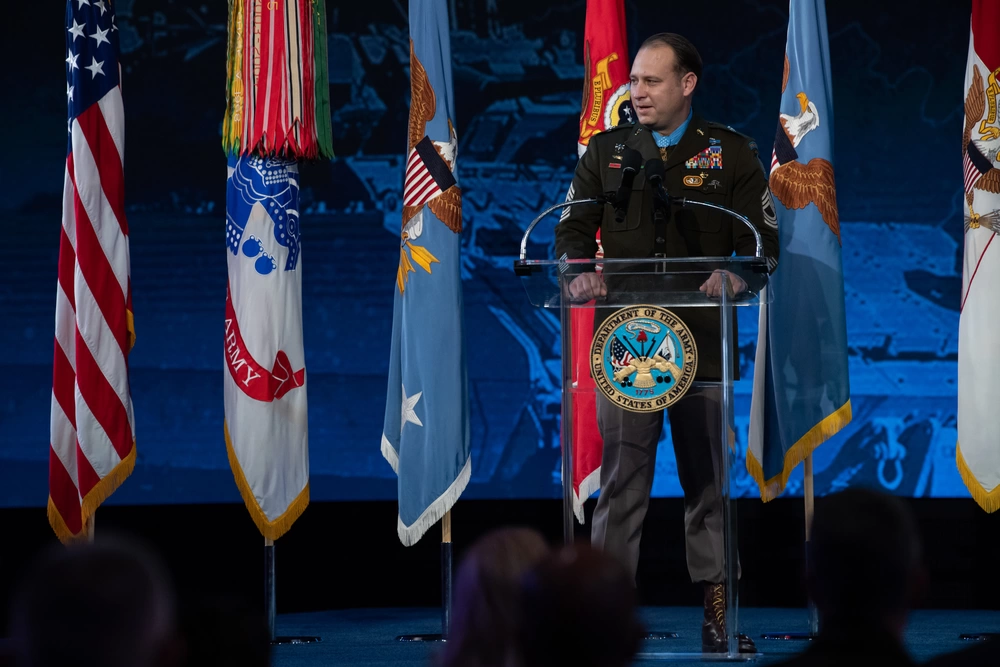 U.S. Army Master Sgt. Earl D. Plumlee gives his remarks during a Medal of Honor Induction Ceremony at Joint Base Myer-Henderson Hall, Va., Dec. 17, 2021. Master Sgt. Plumlee was awarded the Medal of Honor for actions of valor during Operation Enduring Freedom while serving as a weapon’s sergeant with Charlie Company, 4th Battalion, 1st Special Forces Group (Airborne), near Ghazni, Afghanistan, Aug. 28, 2013. (U.S. Army photo by Laura Buchta)