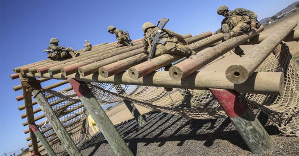  The Marine Recruits of Fox Company, 2nd Recruit Training Battalion, navigate their way through the Weaver obstacle during the Crucible Confidence Course at Edson Range aboard Marine Corps Base Camp Pendleton, Ca.